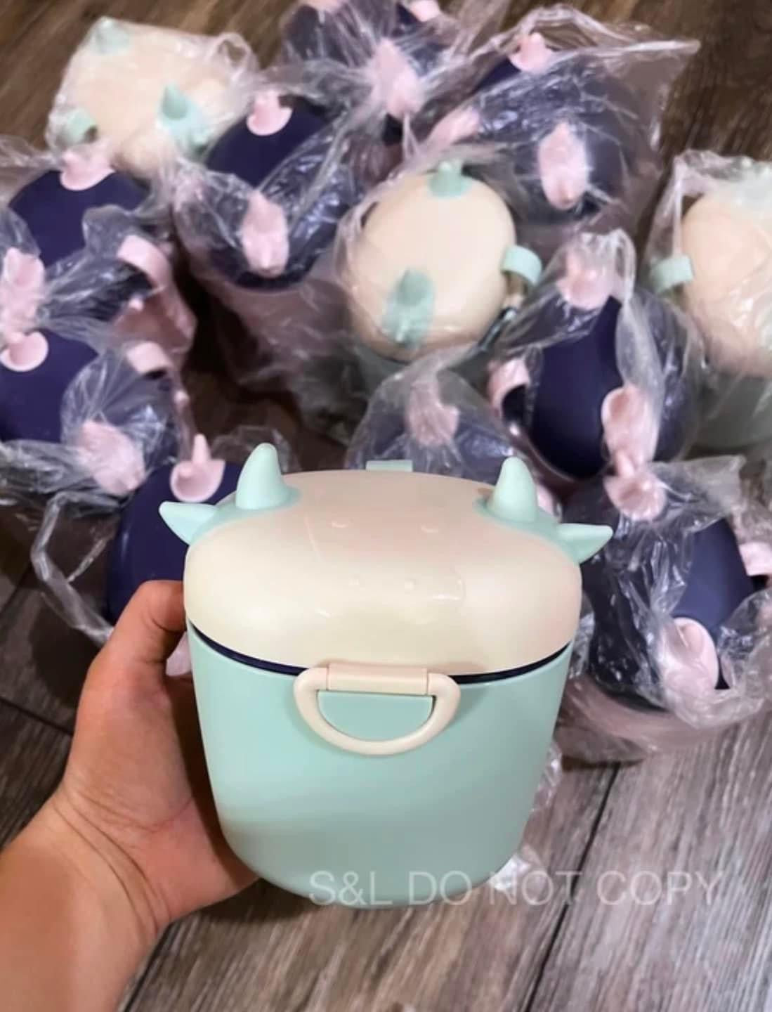 Cow Formula Containers sent at random pink/purple & cream